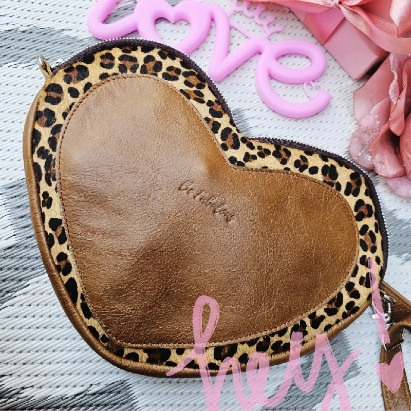The Fabulous Genuine Leather 'Oh my Heart' Leopard print and Plain Heart Crossbody. Elegant Bags, Limited Stock Available The Fabulous Genuine Leather 'Oh my Heart' Leopard print and Plain Heart Crossbody. Elegant Bags, Limited Stock Available