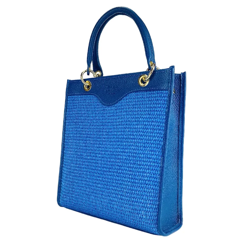 RB1026CH | Vertical women's handbag in genuine leather and straw Made in Italy. Removable and adjustable leather shoulder strap. Polished Gold Accessories - Royal Blue Color - Dimensions: 24 x 29 x 9 cm Grab Your Favorite Handbags At Discounted Prices RB1026CH | Vertical women's handbag in genuine leather and straw Made in Italy. Removable and adjustable leather shoulder strap. Polished Gold Accessories - Royal Blue Color - Dimensions: 24 x 29 x 9 cm Grab Your Favorite Handbags At Discounted Prices
