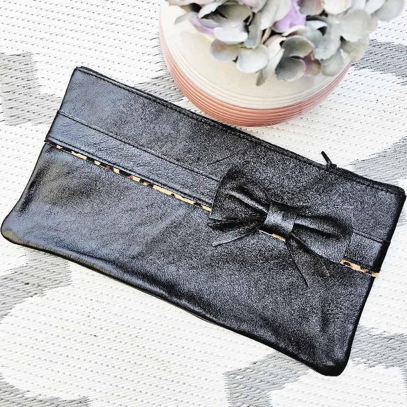 The Fabulous Genuine Leather Leopard and Bow Pencil Bag in Black Luxury Meets Affordability – Shop Stunning Bags Now The Fabulous Genuine Leather Leopard and Bow Pencil Bag in Black Luxury Meets Affordability – Shop Stunning Bags Now